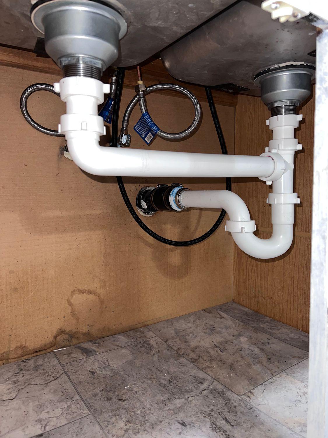 pipes under kitchen sink leak detection