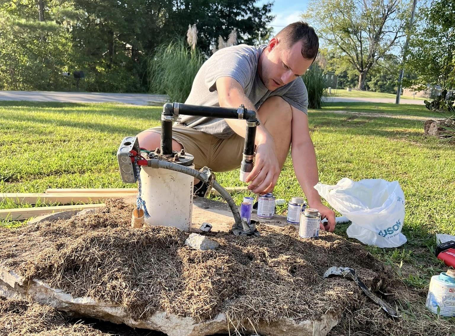 person working on a well